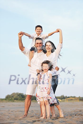 happy young family have fun and live healthy lifestyle on beach happy young family have fun and live healthy lifestyle on beach