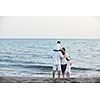 happy young family have fun and live healthy lifestyle on beach