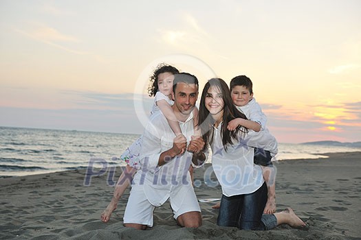 happy young family have fun and live healthy lifestyle on beach happy young family have fun and live healthy lifestyle on beach