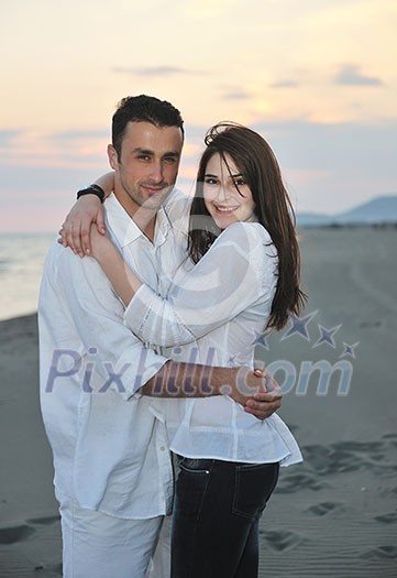 happy young couple have fun and romantic moments on beach at summer season and representing happynes and travel concept happy young couple have fun and romantic moments on beach at summer season and representing happynes and travel concept