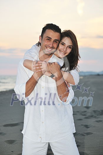happy young couple have fun and romantic moments on beach at summer season and representing happynes and travel concept happy young couple have fun and romantic moments on beach at summer season and representing happynes and travel concept
