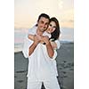 happy young couple have fun and romantic moments on beach at summer season and representing happynes and travel concept