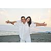 happy young couple have fun and romantic moments on beach at summer season and representing happynes and travel concept