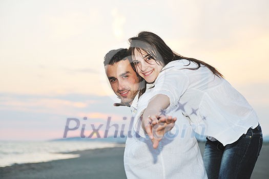 happy young couple have fun and romantic moments on beach at summer season and representing happynes and travel concept happy young couple have fun and romantic moments on beach at summer season and representing happynes and travel concept