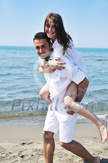 happy young couple have fun and romantic moments on beach at summer season and representing happynes and travel concept happy young couple have fun and romantic moments on beach at summer season and representing happynes and travel concept