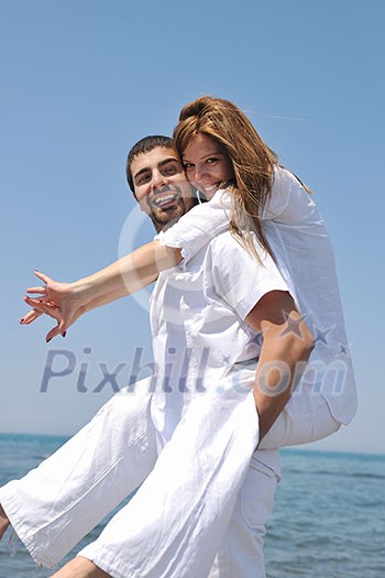 happy young couple have fun and romantic moments on beach at summer season and representing happynes and travel concept happy young couple have fun and romantic moments on beach at summer season and representing happynes and travel concept