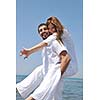 happy young couple have fun and romantic moments on beach at summer season and representing happynes and travel concept