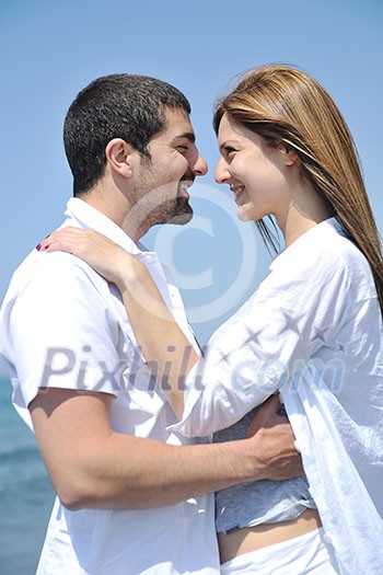 happy young couple have fun and romantic moments on beach at summer season and representing happynes and travel concept happy young couple have fun and romantic moments on beach at summer season and representing happynes and travel concept