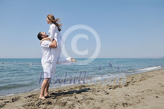 happy young couple have fun and romantic moments on beach at summer season and representing happynes and travel concept happy young couple have fun and romantic moments on beach at summer season and representing happynes and travel concept