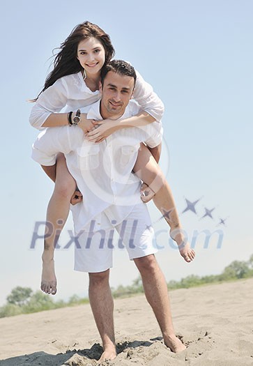 happy young couple have fun and romantic moments on beach at summer season and representing happynes and travel concept happy young couple have fun and romantic moments on beach at summer season and representing happynes and travel concept