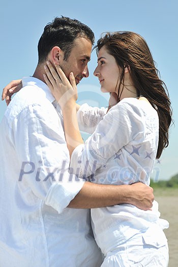happy young couple have fun and romantic moments on beach at summer season and representing happynes and travel concept happy young couple have fun and romantic moments on beach at summer season and representing happynes and travel concept