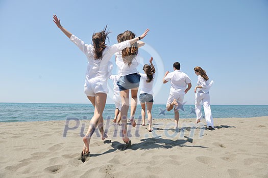 happy people group have fun run and jump on beach beautiful sand beach happy people group have fun run and jump on beach beautiful sand beach