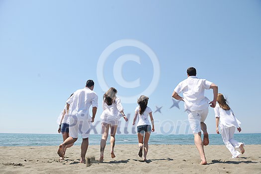 happy people group have fun run and jump on beach beautiful sand beach happy people group have fun run and jump on beach beautiful sand beach
