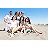 happy young people group have fun  run and jump  on beach beautiful sand  beach