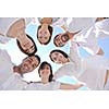 Group of happy young people in circle at beach  have fun and smile