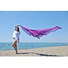 beautiful young woman on beach with scarf relax smile and have fun