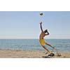 male beach volleyball game player jump on hot sand