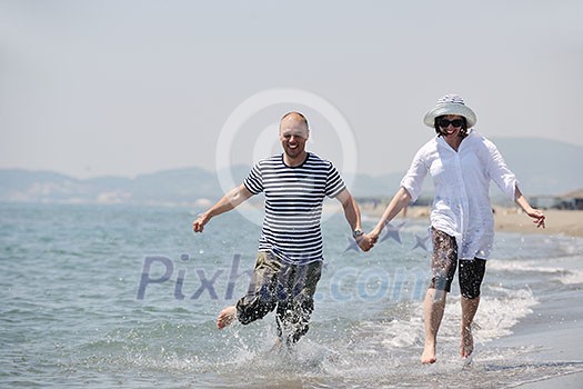 happy young couple have fun and romantic moments on beach at summer season and representing happynes and travel concept happy young couple have fun and romantic moments on beach at summer season and representing happynes and travel concept