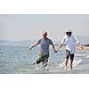 happy young couple have fun and romantic moments on beach at summer season and representing happynes and travel concept