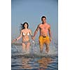 happy young couple have fun and romantic moments on beach at summer season and representing happynes and travel concept