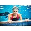 Female swimmer in an indoor swimming pool - doing crawl (shallow DOF)