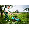 Senior man gardening in his garden (color toned image)