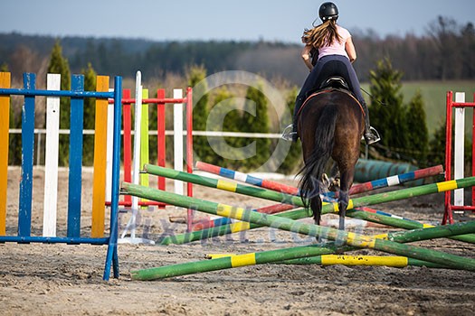 Young woman show jumping with horse Young woman show jumping with horse
