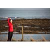 Young woman on her evening jog along the seacoast