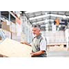 Man buying construction wood in a  DIY store for his DIY home re-modeling project
