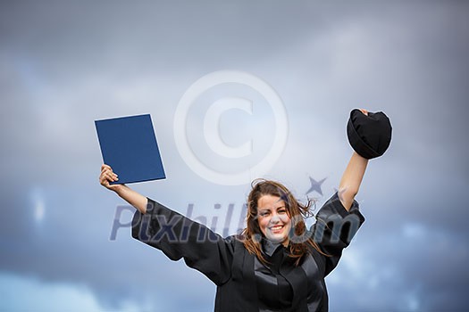 Pretty, young woman celebrating joyfully her graduation - spreading wide her arms, holding her diploma, savouring her success (color toned image; shallow DOF) Pretty, young woman celebrating joyfully her graduation - spreading wide her arms, holding her diploma, savouring her success (color toned image; shallow DOF)