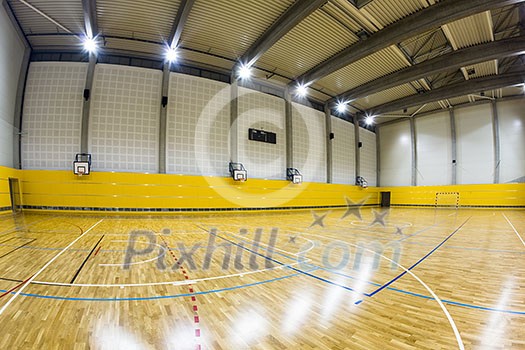 Interior of a modern multifunctional gymnasium with young people Interior of a modern multifunctional gymnasium with young people