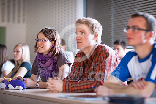 College students sitting in a classroom during class (shallow DOF; color toned image) College students sitting in a classroom during class (shallow DOF; color toned image)
