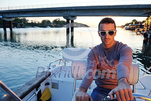happy young man have fun at boat at sunset on summer season happy young man have fun at boat at sunset on summer season