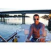 happy young man have fun at boat at sunset on summer season