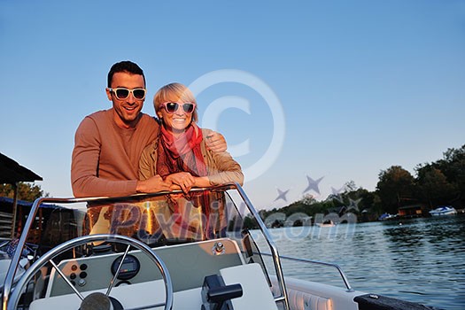 happy young couple in love have romantic time at summer sunset at ship boat while representing urban and countryside fashin lifestyle happy young couple in love have romantic time at summer sunset at ship boat while representing urban and countryside fashin lifestyle