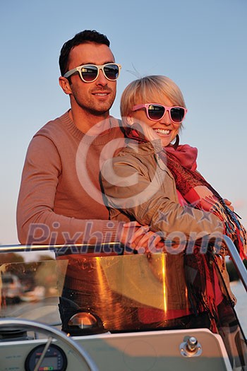happy young couple in love have romantic time at summer sunset at ship boat while representing urban and countryside fashin lifestyle happy young couple in love have romantic time at summer sunset at ship boat while representing urban and countryside fashin lifestyle