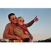 happy young couple in love  have romantic time at summer sunset   at ship boat while  representing urban and countryside fashin lifestyle