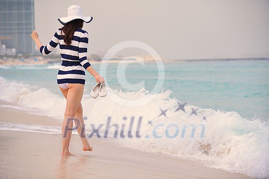 Happy Beautiful Woman Enjoying Summer Vacation on beach Happy Beautiful Woman Enjoying Summer Vacation on beach