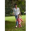 happy family playing together outdoor  in park mother with kids  running on grass