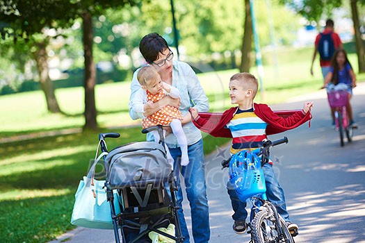 portrait of happy young family, mother and kids have fun in park portrait of happy young family, mother and kids have fun in park
