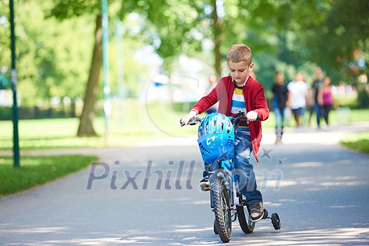 Young boy on the bicycle at Park Young boy on the bicycle at Park