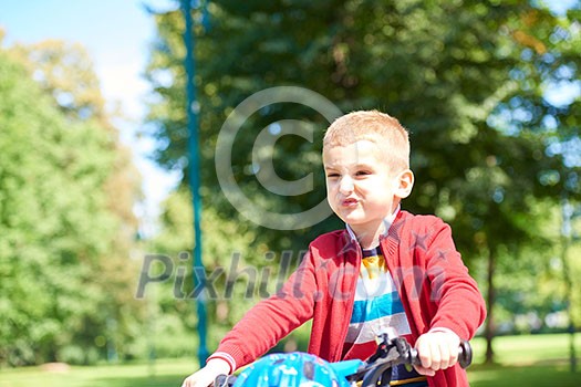 Young boy on the bicycle at Park Young boy on the bicycle at Park