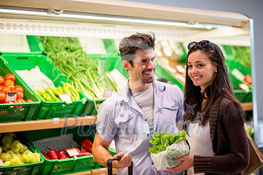 Young couple shopping in a supermarket Young couple shopping in a supermarket