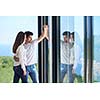 romantic happy young couple relax at modern home staircase indoors