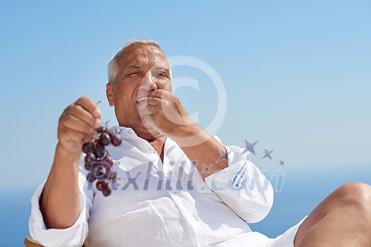 Portrait of senior man sitting outside Portrait of senior man sitting outside