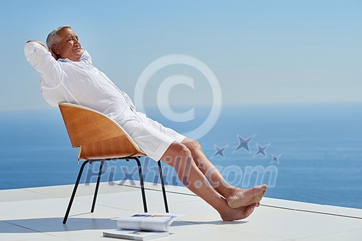 Portrait of senior man sitting outside Portrait of senior man sitting outside