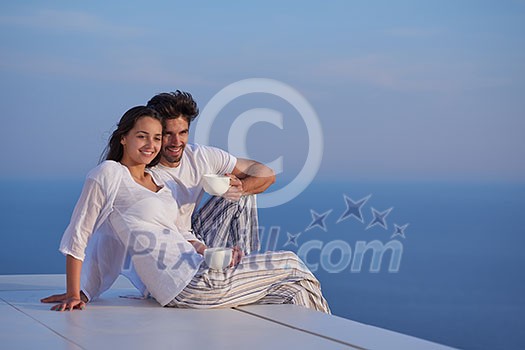 happy young romantic couple have fun relax smile at modern home outdoor terace balcony terace happy young romantic couple have fun relax smile at modern home outdoor terace balcony terace