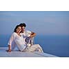 happy young romantic couple have fun relax smile at modern home outdoor terace balcony terace