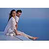 happy young romantic couple have fun relax smile at modern home outdoor terace balcony terace