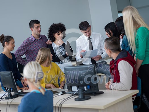 group of students with teacher in computer lab classrom learrning lessons, get help and support group of students with teacher in computer lab classrom learrning lessons, get help and support
